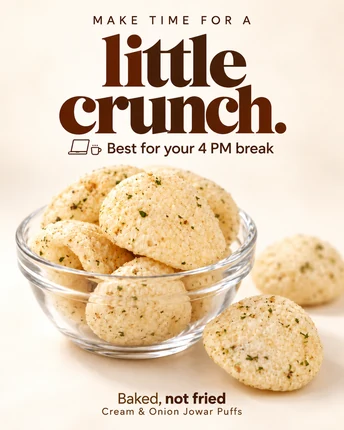 Make time for a little crunch. Best for your 4 PM break — Cream & Onion Jowar Puffs in a glass bowl, baked, not fried.